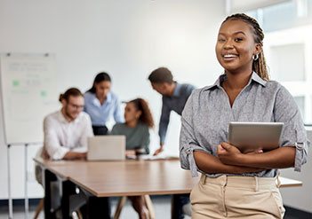 Woman standing in front of a meeting.